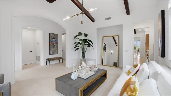 a living room with furniture and a table