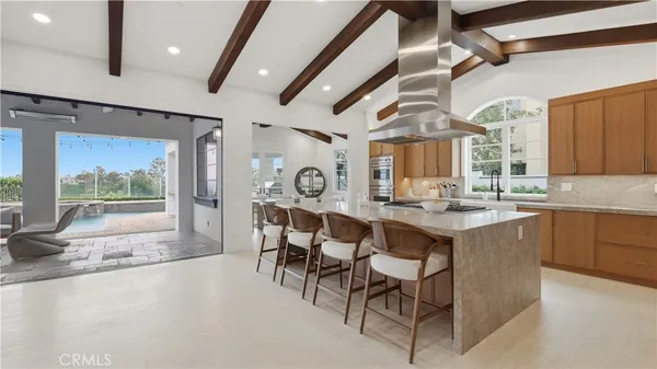 a large kitchen with a large window and counter space