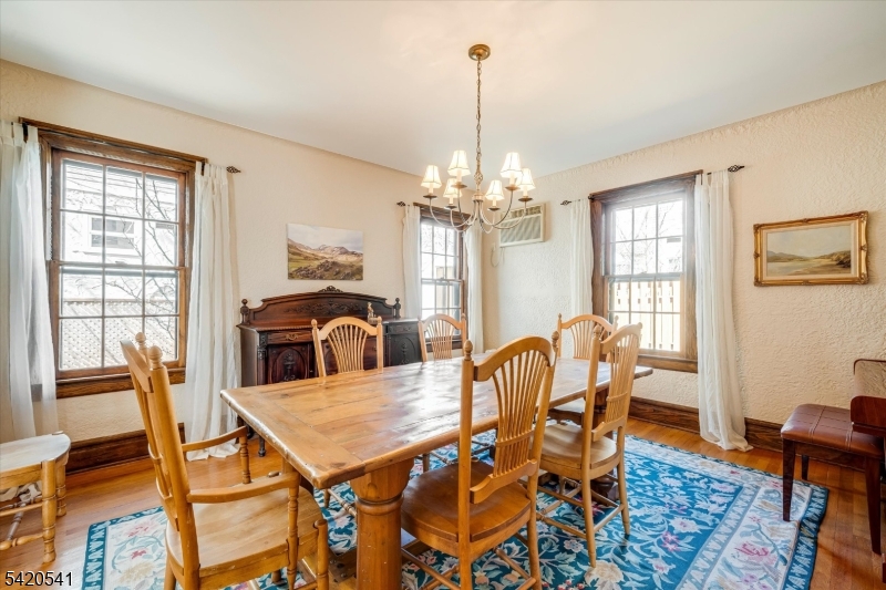 55 Luddington Road West Orange, NJ 07052 - Photo 15 of 40 a view of a dining room with furniture window and wooden floor