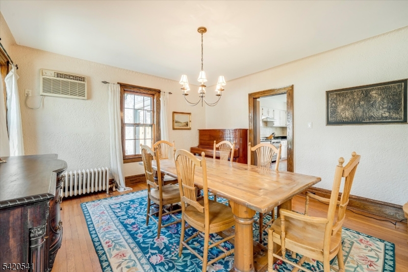55 Luddington Road West Orange, NJ 07052 - Photo 18 of 40 a view of a dining room with furniture and wooden floor