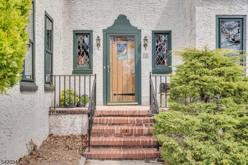 55 Luddington Road West Orange, NJ 07052 - Photo 2 of 40 a front view of a house with a garden