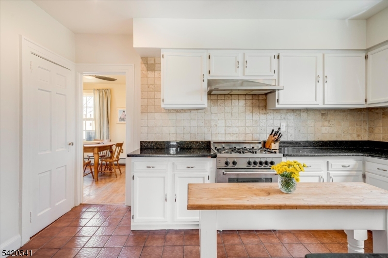 55 Luddington Road West Orange, NJ 07052 - Photo 21 of 40 a kitchen with stainless steel appliances granite countertop a stove a sink and a white cabinets