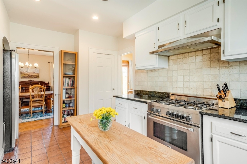 55 Luddington Road West Orange, NJ 07052 - Photo 22 of 40 a kitchen with stainless steel appliances a stove a sink and a wooden cabinets