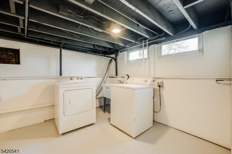 55 Luddington Road West Orange, NJ 07052 - Photo 35 of 40 a utility room with dryer and washer
