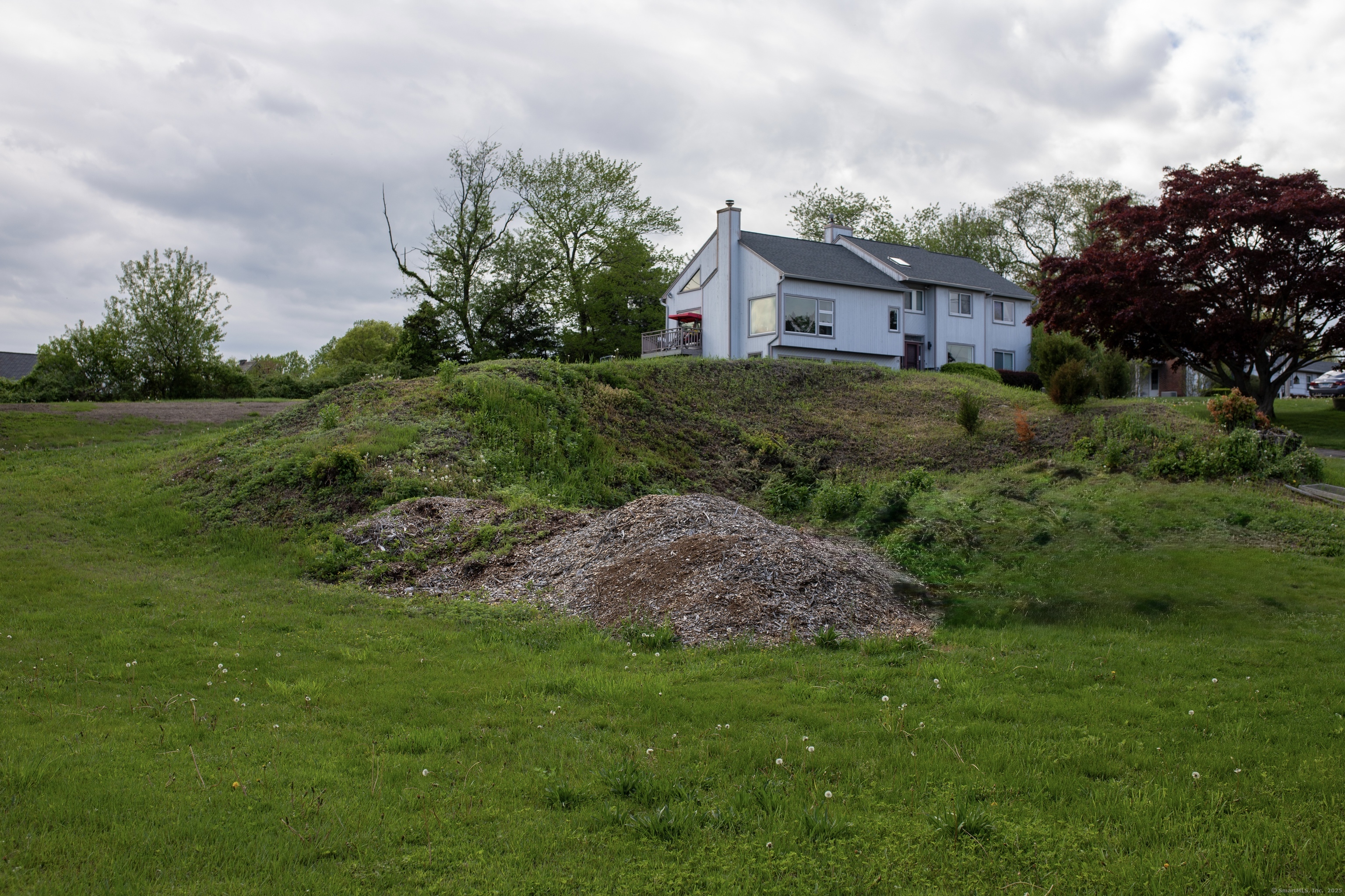 Lot 194 Prospect Avenue Trumbull, CT 06611 - Photo 3 of 5 a view of a house with a big yard and potted plants