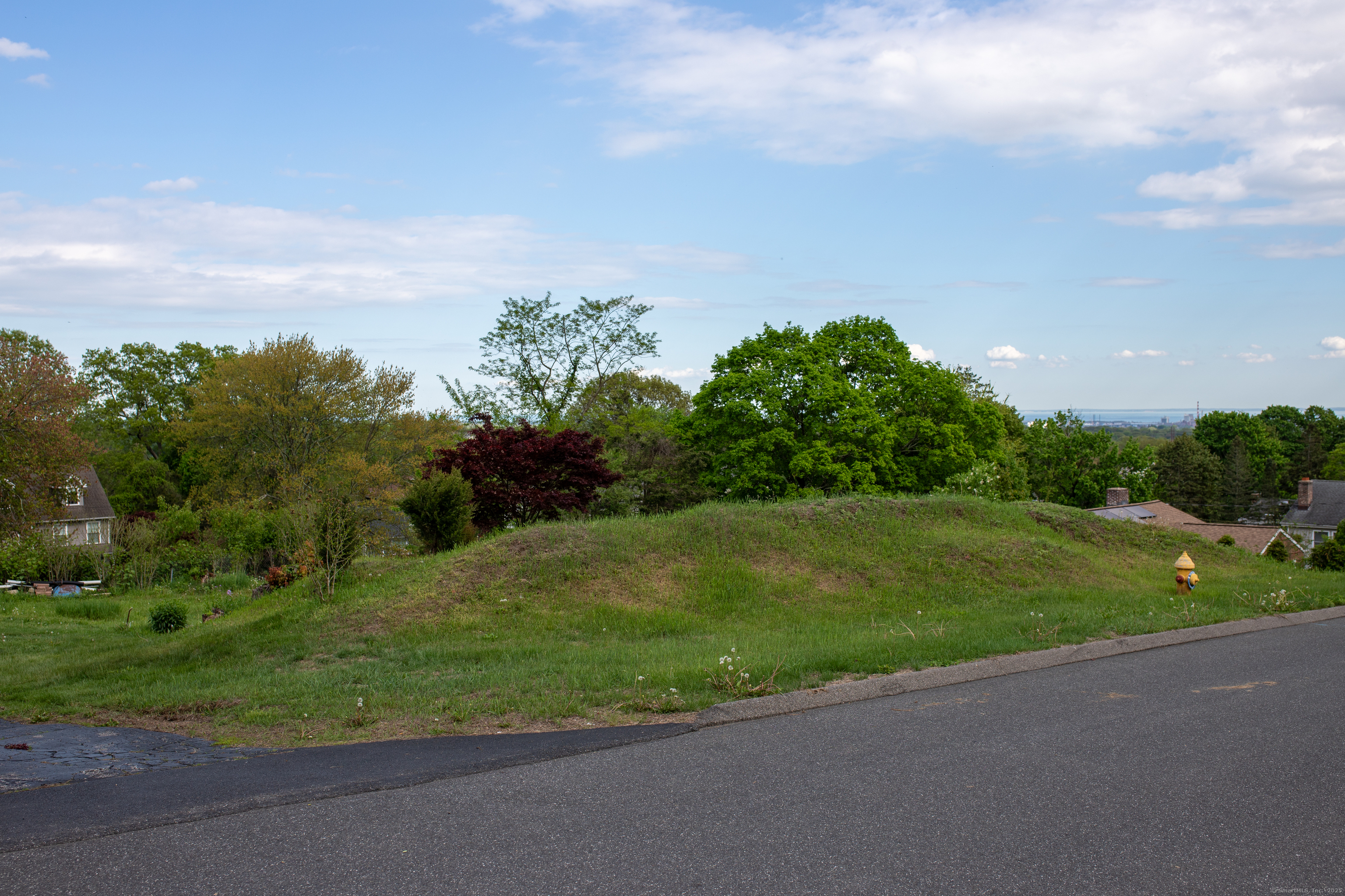 Lot 194 Prospect Avenue Trumbull, CT 06611 - Photo 4 of 5 a view of a field of grass and trees