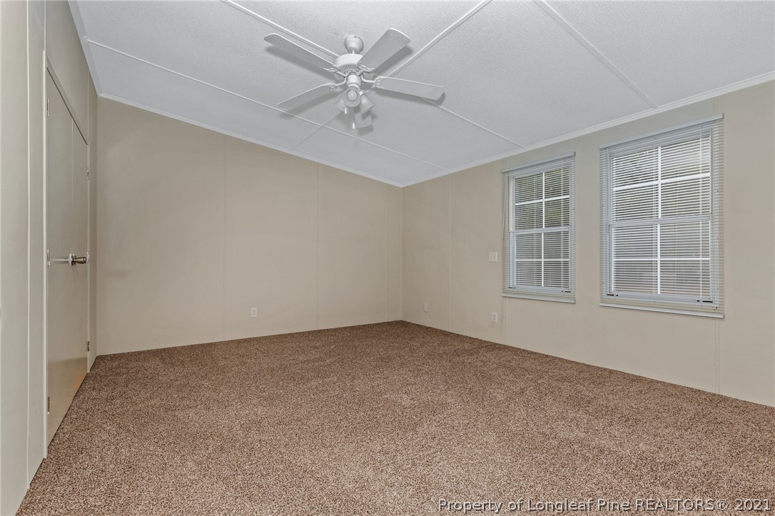 6544 Sandy Creek Road Stedman, NC 28391 - Photo 18 of 32 an empty room with windows