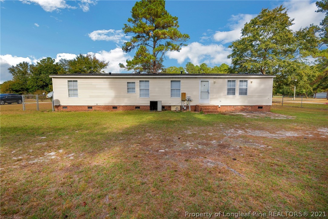 6544 Sandy Creek Road Stedman, NC 28391 - Photo 28 of 32 a view of a house with a big yard
