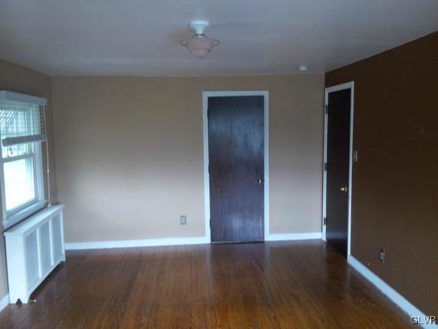 2110 Center Street Bethlehem, PA 18017 - Photo 11 of 12 an empty room with wooden floor and windows