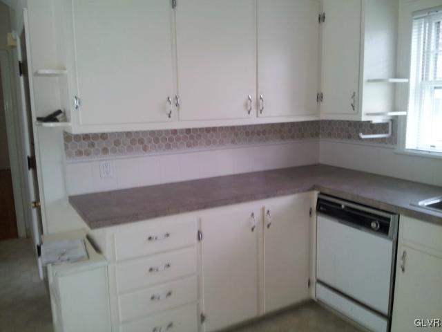 2110 Center Street Bethlehem, PA 18017 - Photo 5 of 12 a kitchen with white cabinets and a sink