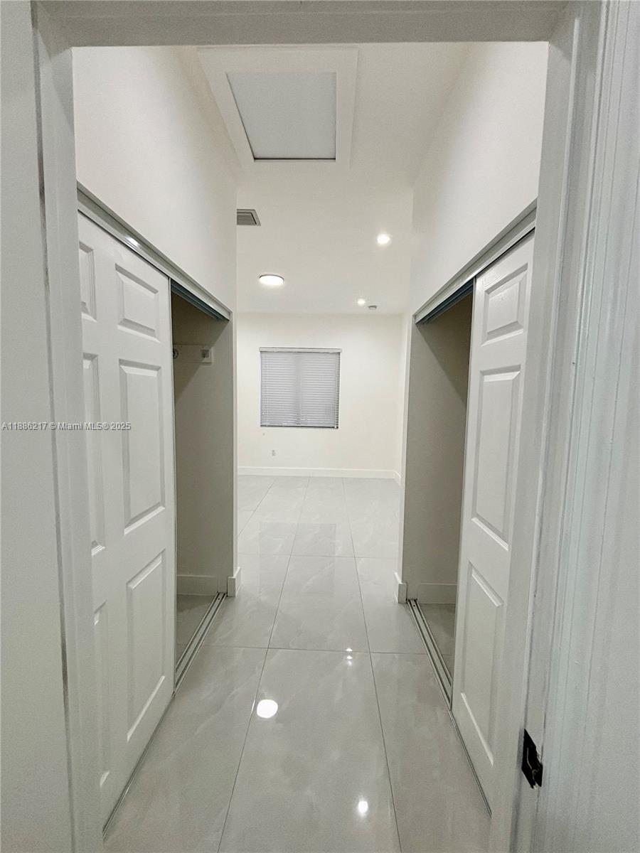 5737 Cleveland Street, Unit 2 Hollywood, FL 33021 - Photo 13 of 18 a view of a hallway