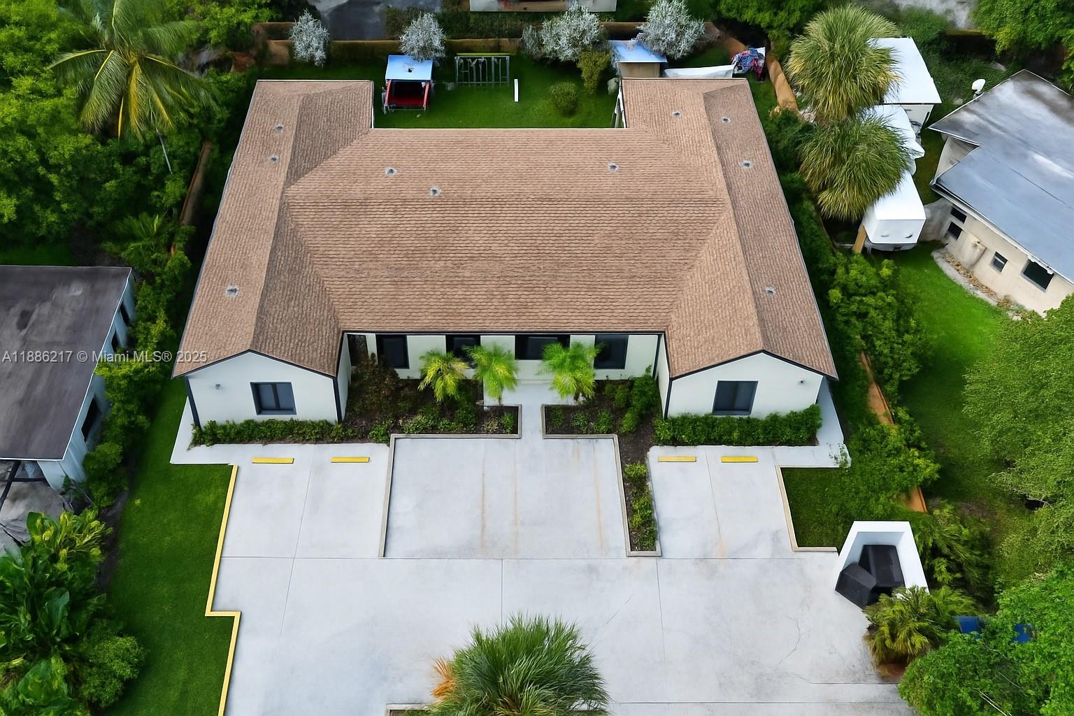 5737 Cleveland Street, Unit 2 Hollywood, FL 33021 - Photo 17 of 18 an aerial view of a house with a yard and potted plants
