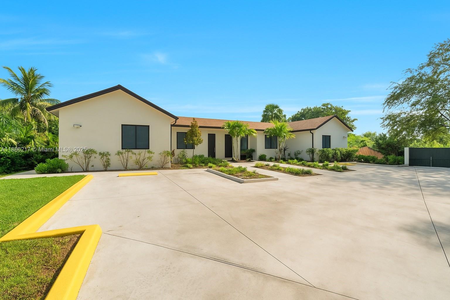 5737 Cleveland Street, Unit 2 Hollywood, FL 33021 - Photo 18 of 18 a front view of house with yard and green space