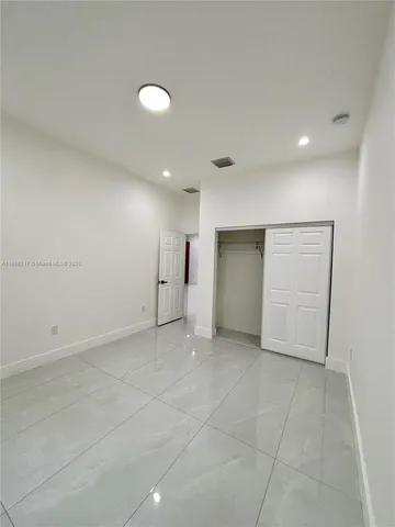 an empty room with a bathroom