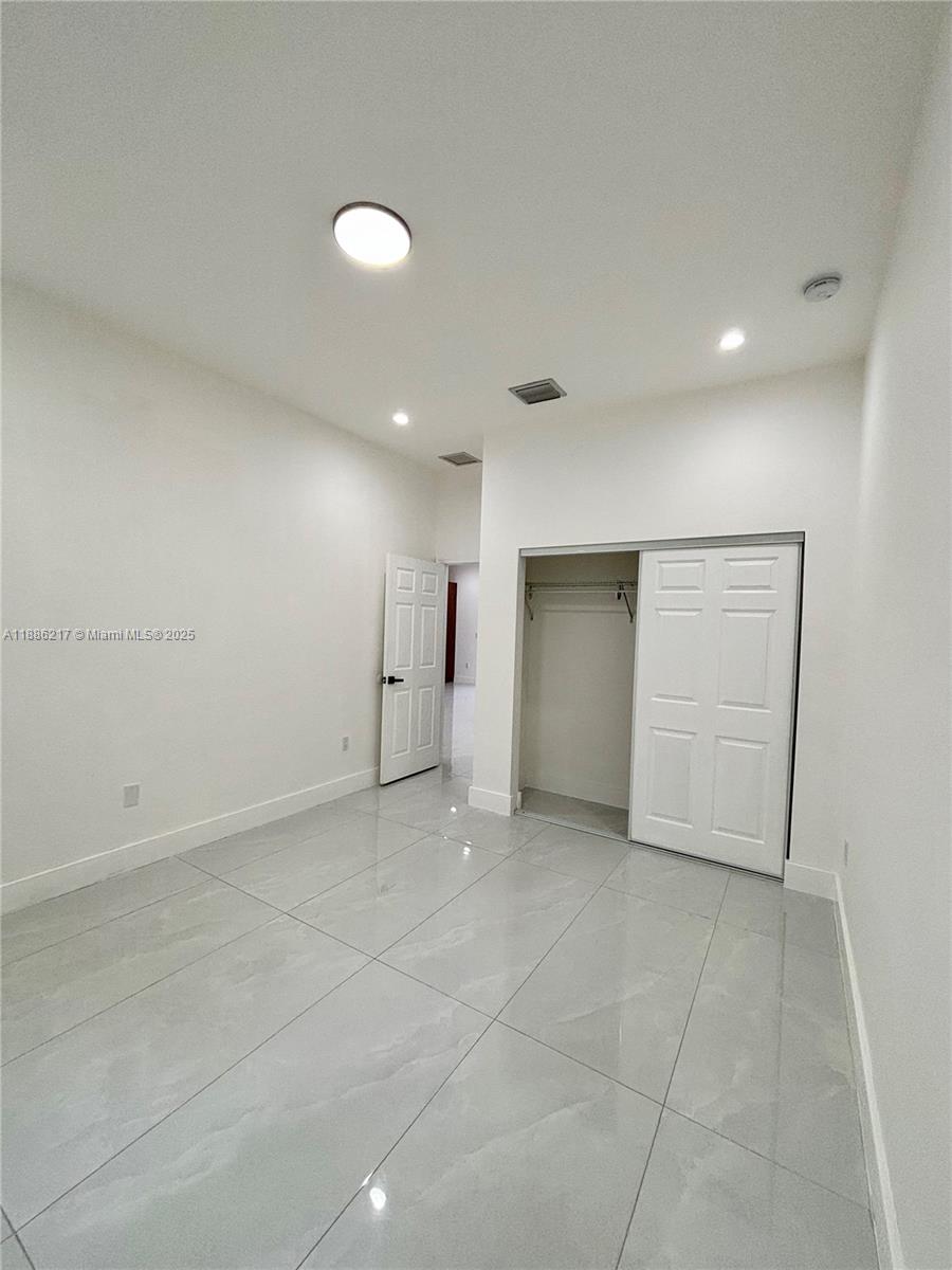 5737 Cleveland Street, Unit 2 Hollywood, FL 33021 - Photo 5 of 18 an empty room with a bathroom