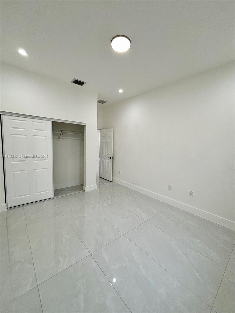 5737 Cleveland Street, Unit 2 Hollywood, FL 33021 - Photo 8 of 18 a view of an empty room