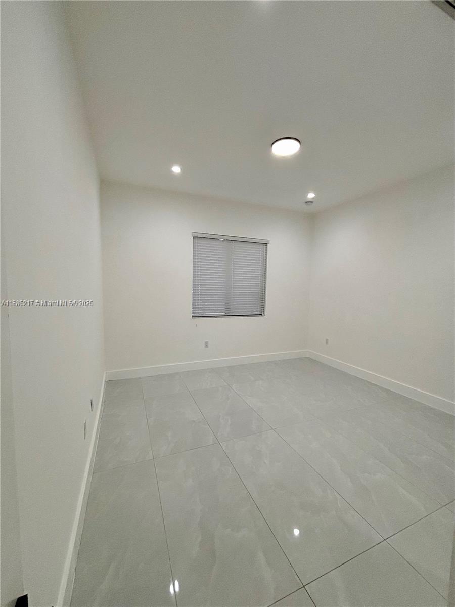 5737 Cleveland Street, Unit 2 Hollywood, FL 33021 - Photo 9 of 18 a view of an empty room