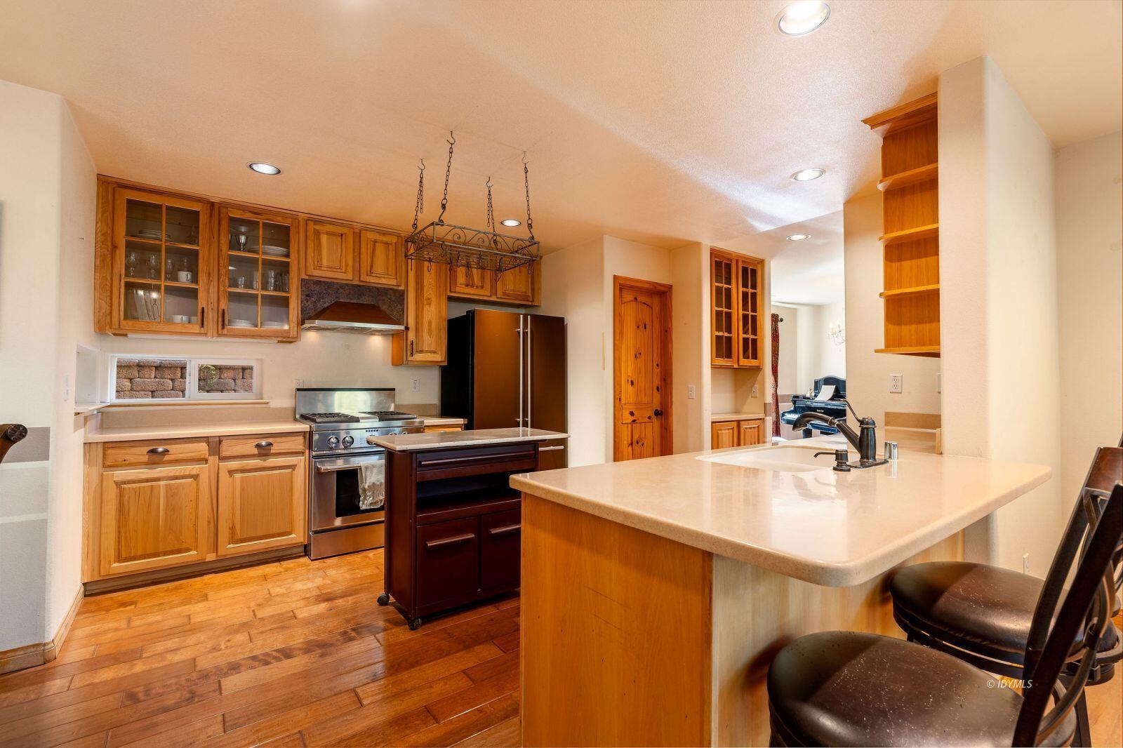 25262 Deer Path Road Idyllwild, CA 92549 - Photo 13 of 45 a kitchen with stainless steel appliances granite countertop a sink stove and refrigerator
