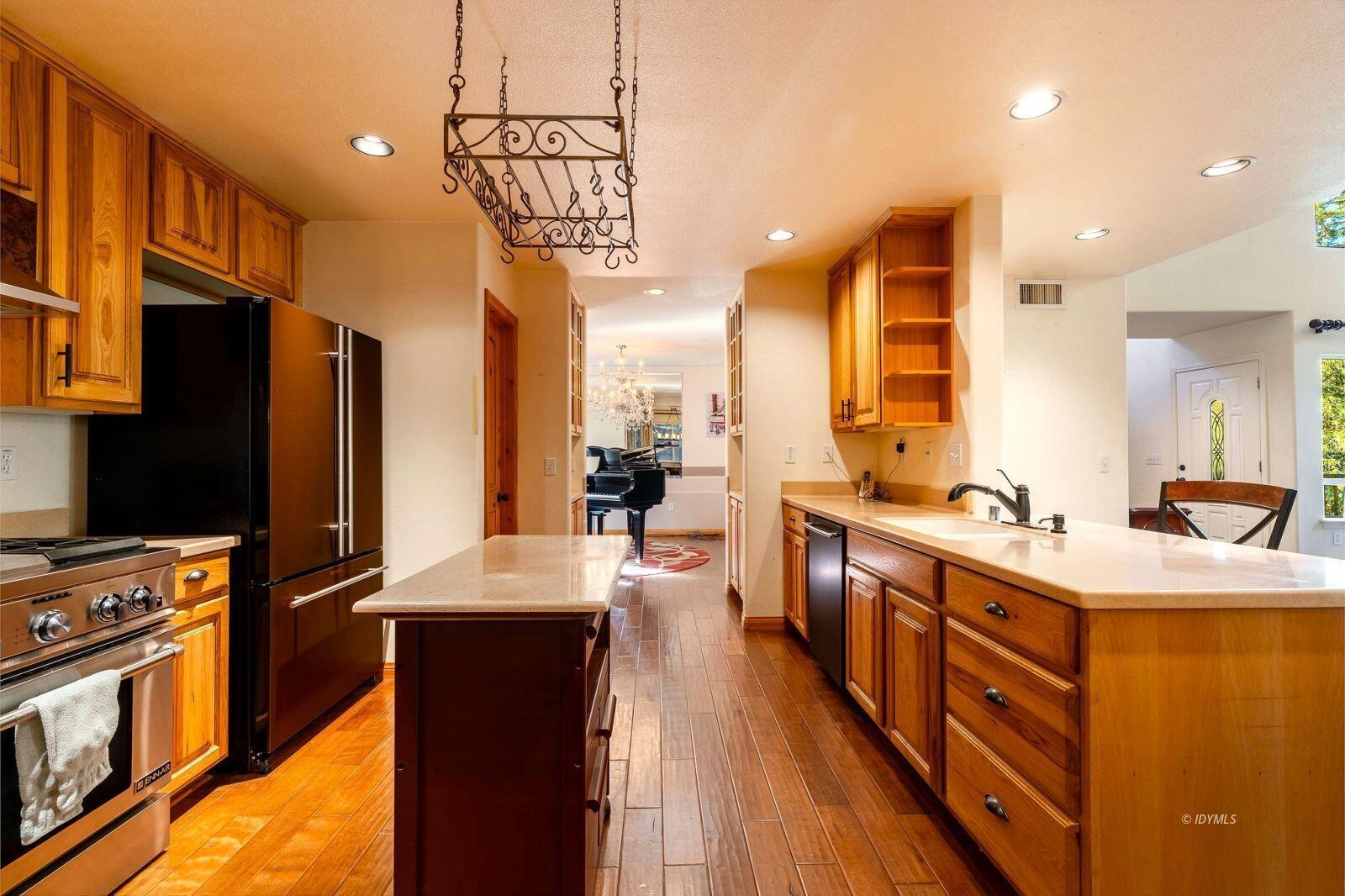 25262 Deer Path Road Idyllwild, CA 92549 - Photo 14 of 45 a kitchen with stainless steel appliances a sink stove and refrigerator
