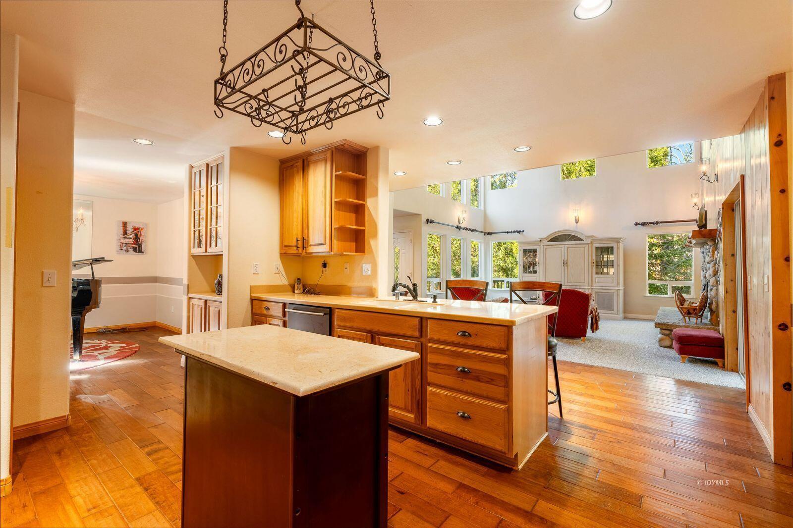 25262 Deer Path Road Idyllwild, CA 92549 - Photo 15 of 45 a large kitchen with a table and chairs in it
