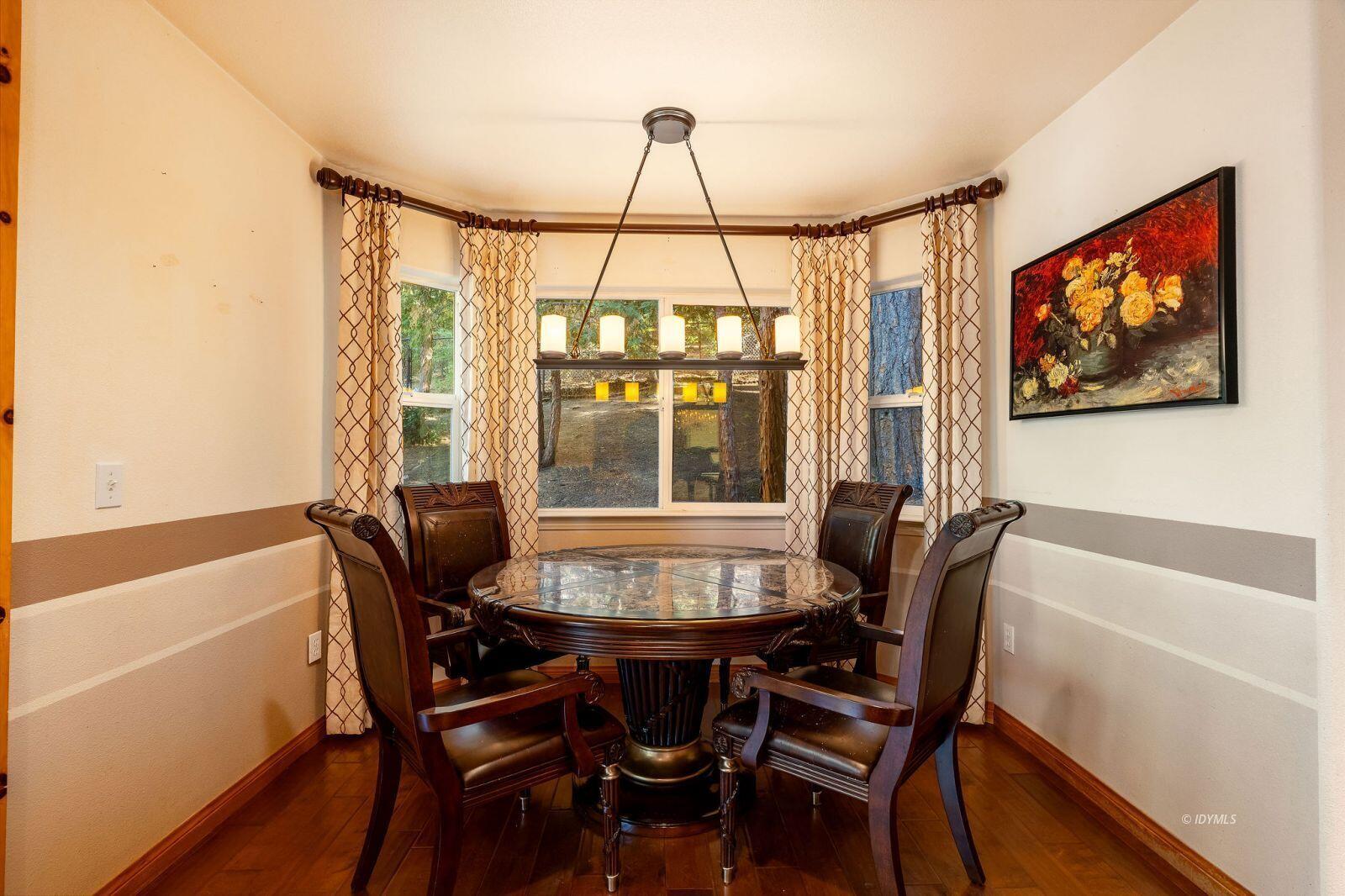 25262 Deer Path Road Idyllwild, CA 92549 - Photo 16 of 45 a view of a dining room with furniture and window