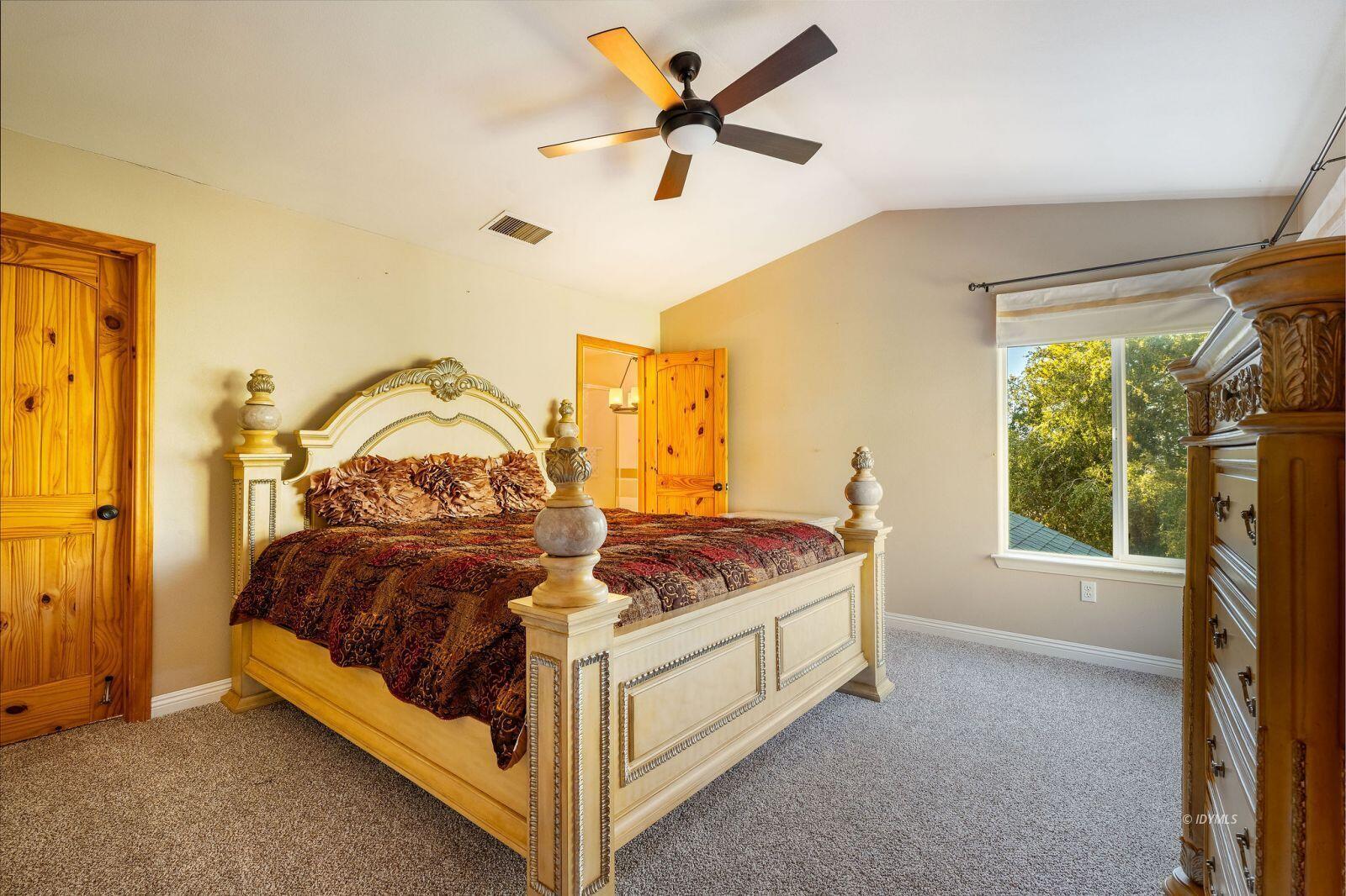 25262 Deer Path Road Idyllwild, CA 92549 - Photo 26 of 45 a bedroom with a bed and a window