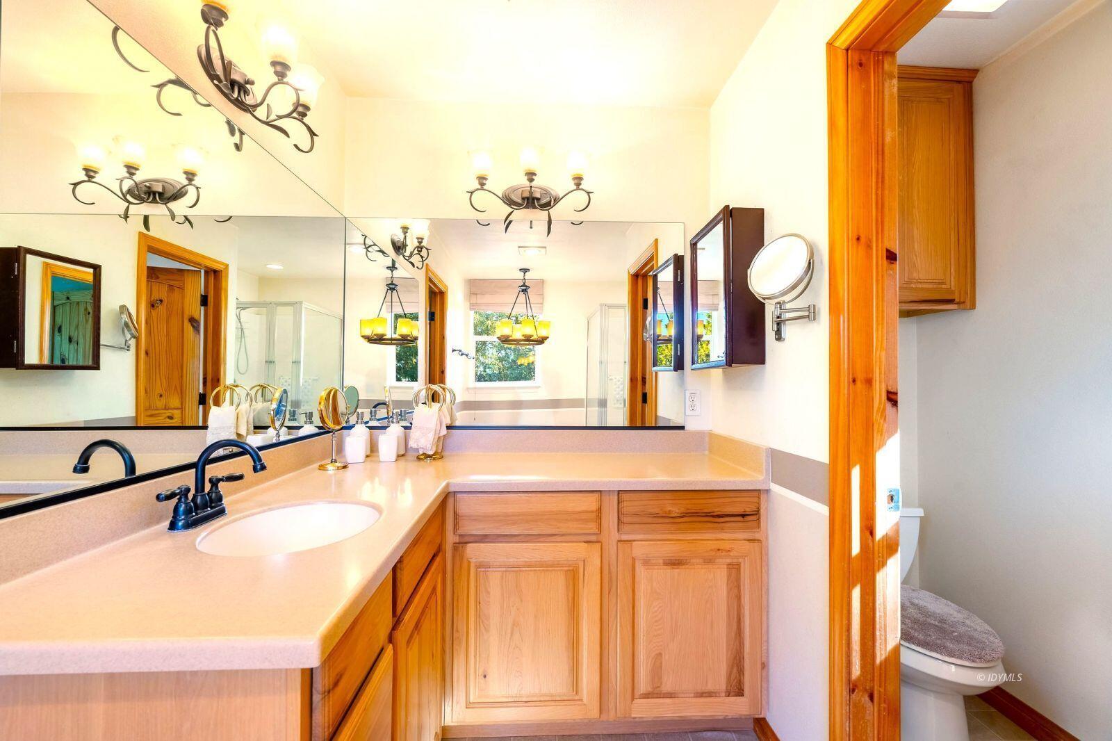 25262 Deer Path Road Idyllwild, CA 92549 - Photo 29 of 45 a spacious bathroom with a sink double vanity and mirror