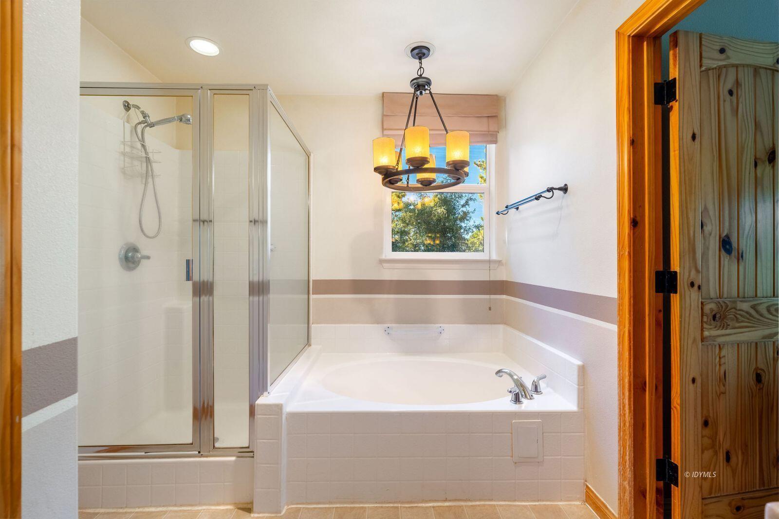 25262 Deer Path Road Idyllwild, CA 92549 - Photo 30 of 45 a bathroom with a bathtub and a shower