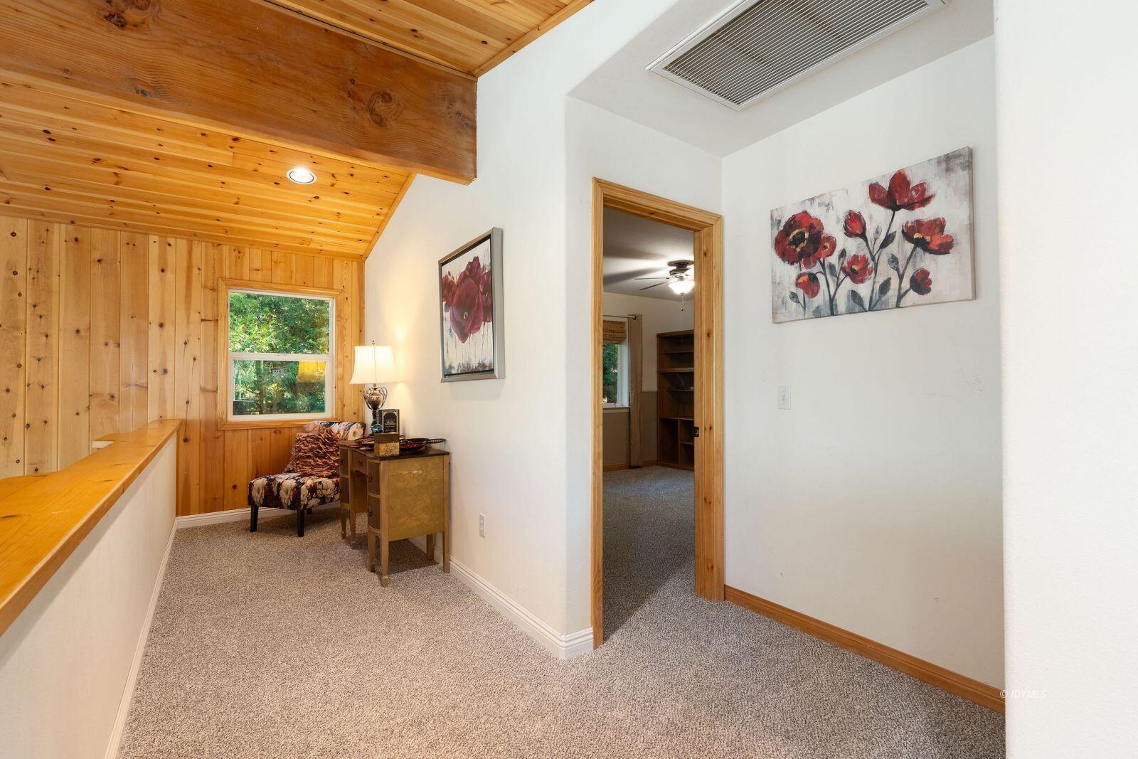 25262 Deer Path Road Idyllwild, CA 92549 - Photo 33 of 45 a view of a hallway with couch and dining area