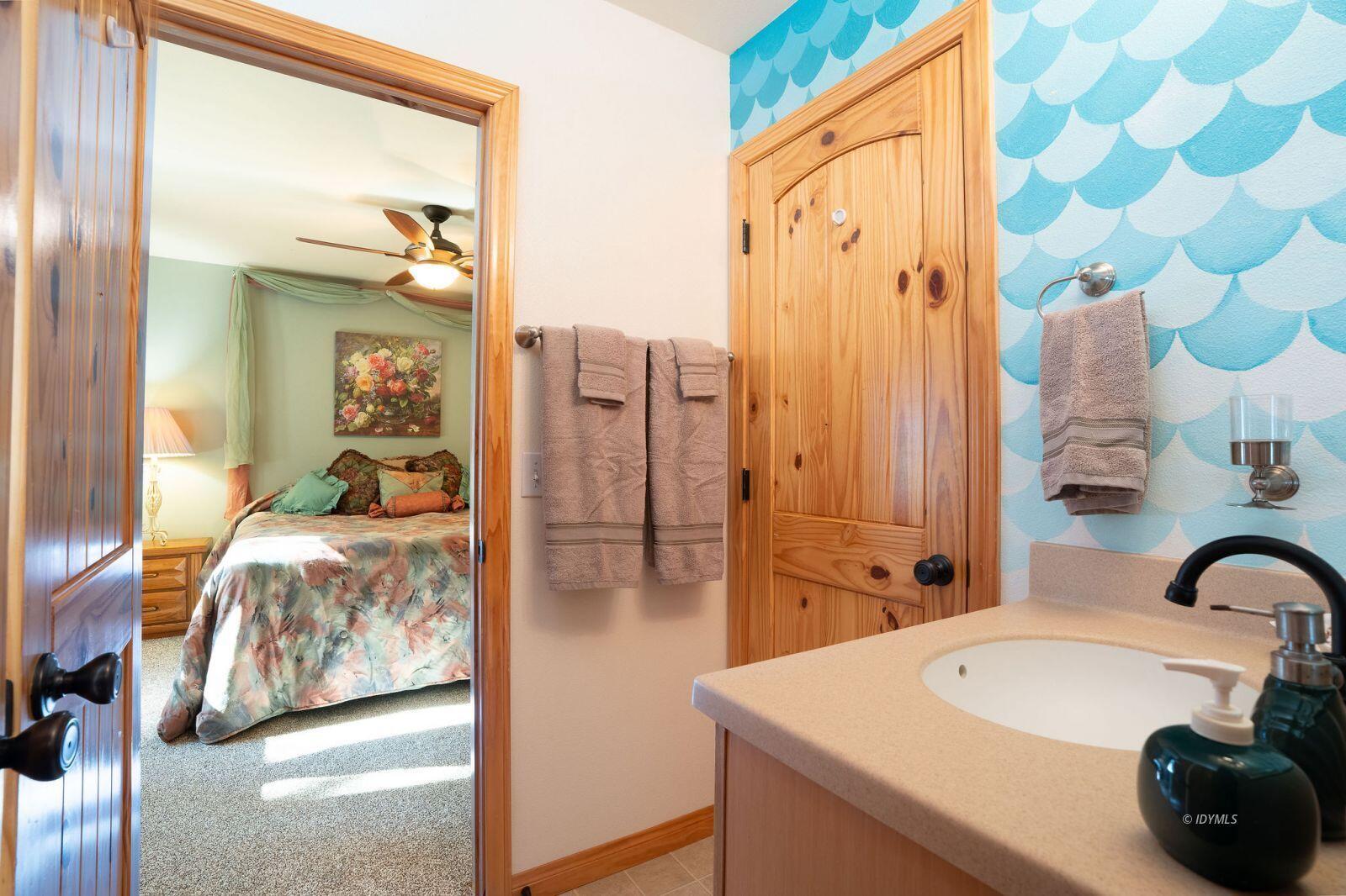 25262 Deer Path Road Idyllwild, CA 92549 - Photo 36 of 45 a en suite bathroom with a sink and a mirror