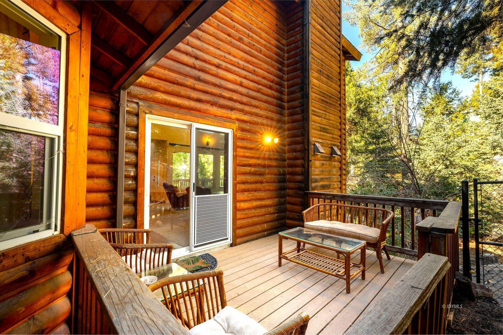 25262 Deer Path Road Idyllwild, CA 92549 - Photo 39 of 45 a roof deck with a couch and wooden floor