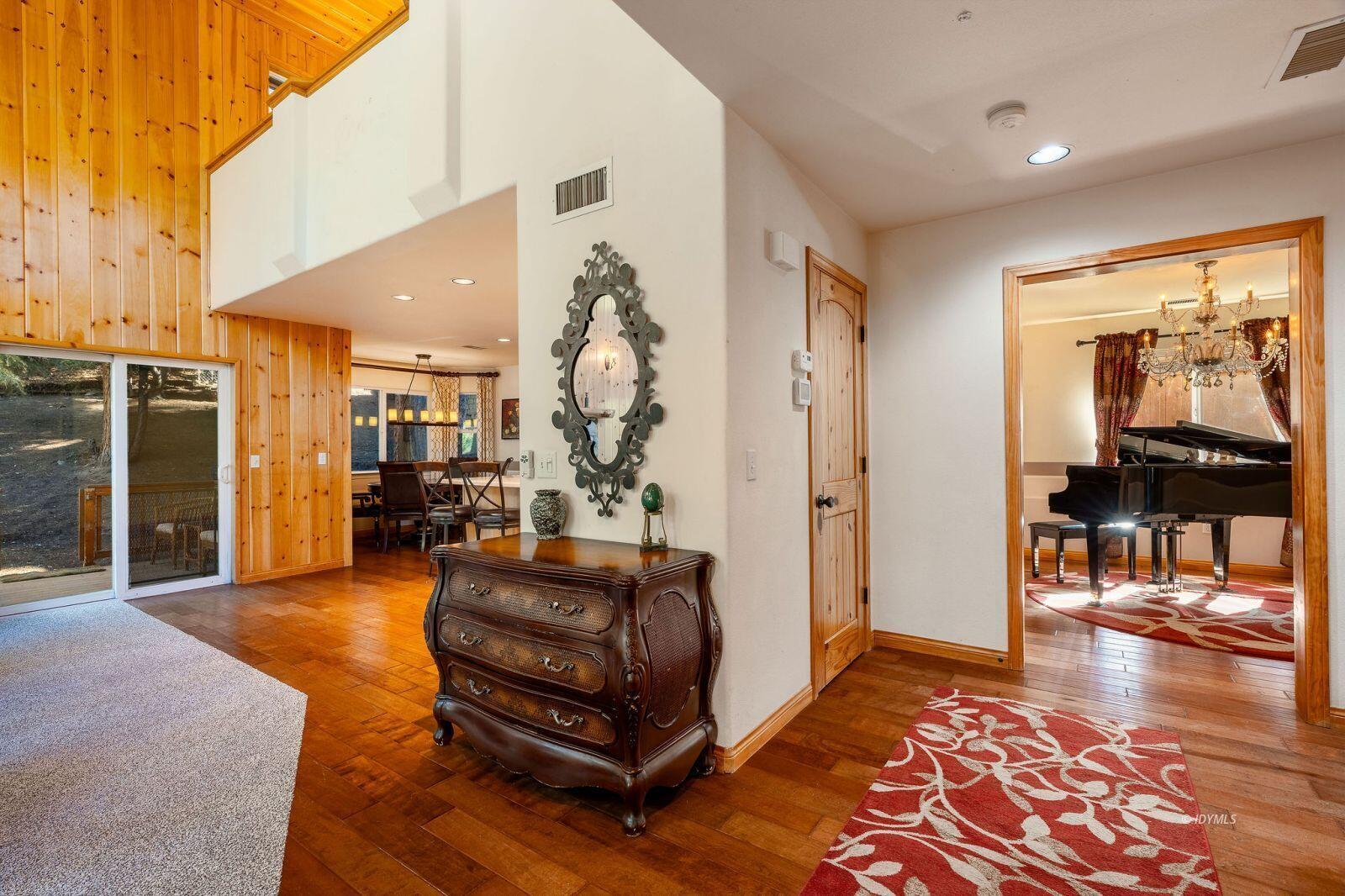 25262 Deer Path Road Idyllwild, CA 92549 - Photo 6 of 45 a living room with furniture a rug and kitchen view