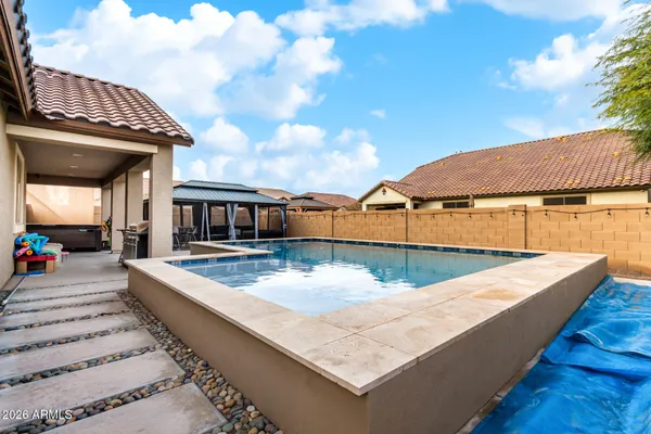 a view of a swimming pool with a lounge chairs