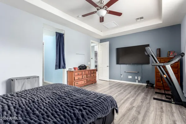 a bedroom with bed and tv