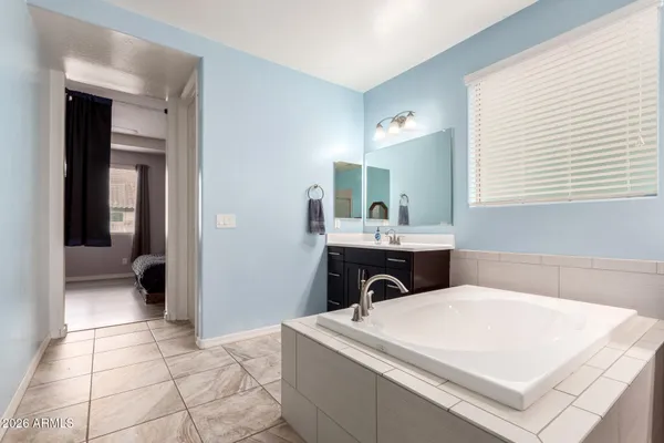 a bathroom with a sink a vanity and a mirror