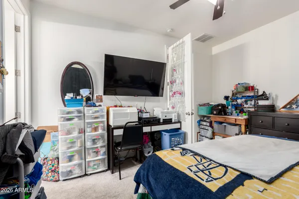 a bedroom with a workspace