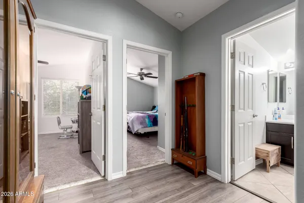 a en suite bathroom with a glass door shower and a sink