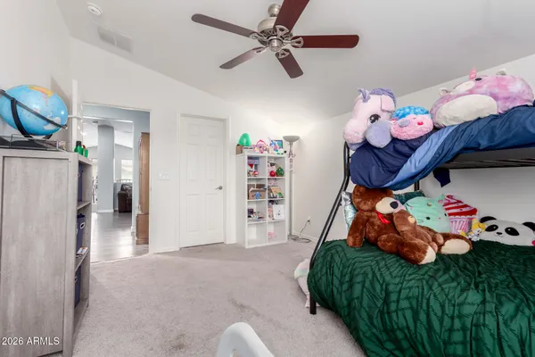 a bedroom with furniture and a bed