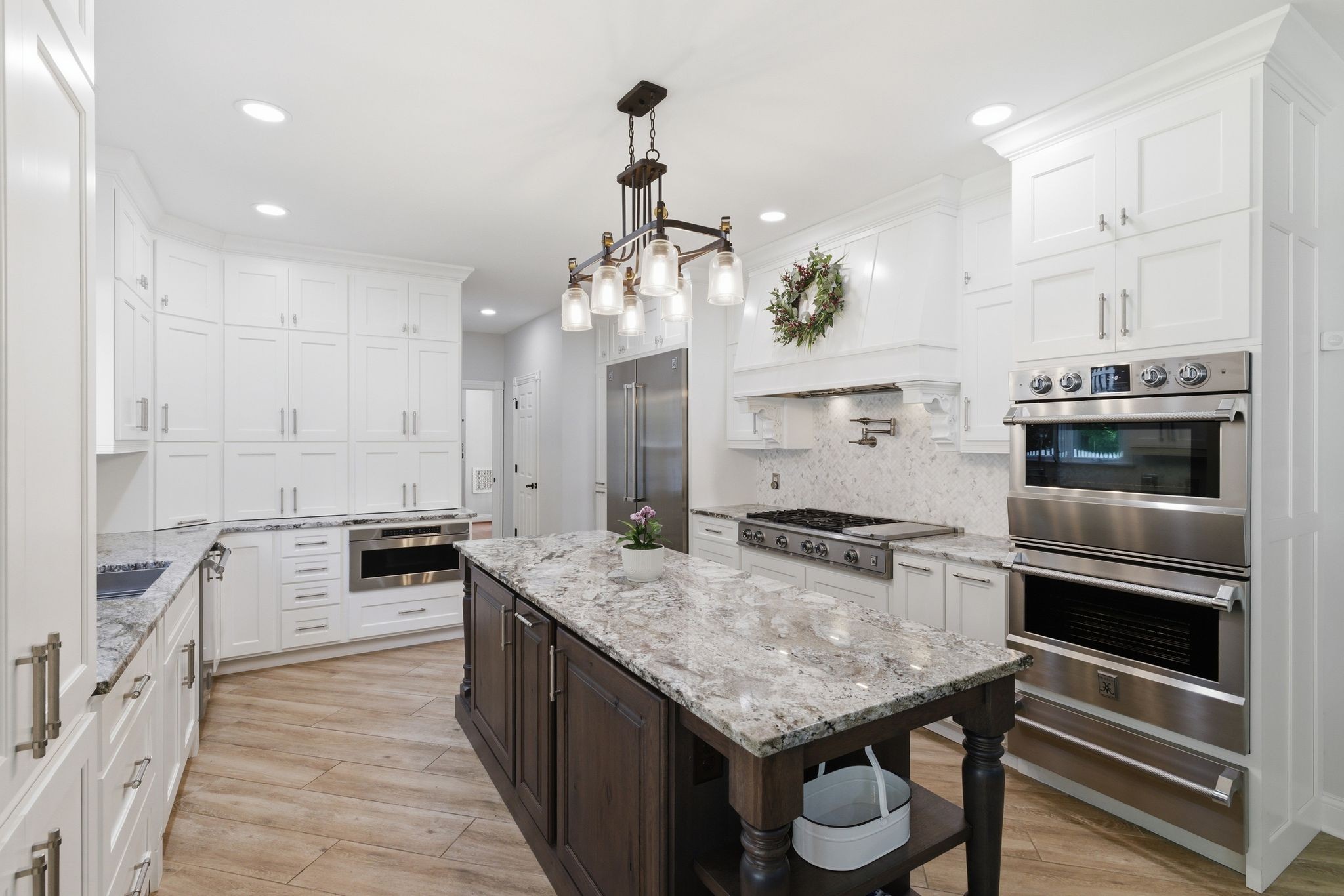 3016 Duplex Road Spring Hill, TN 37174 - Photo 12 of 61 a kitchen with granite countertop kitchen island stainless steel appliances a stove refrigerator and cabinets