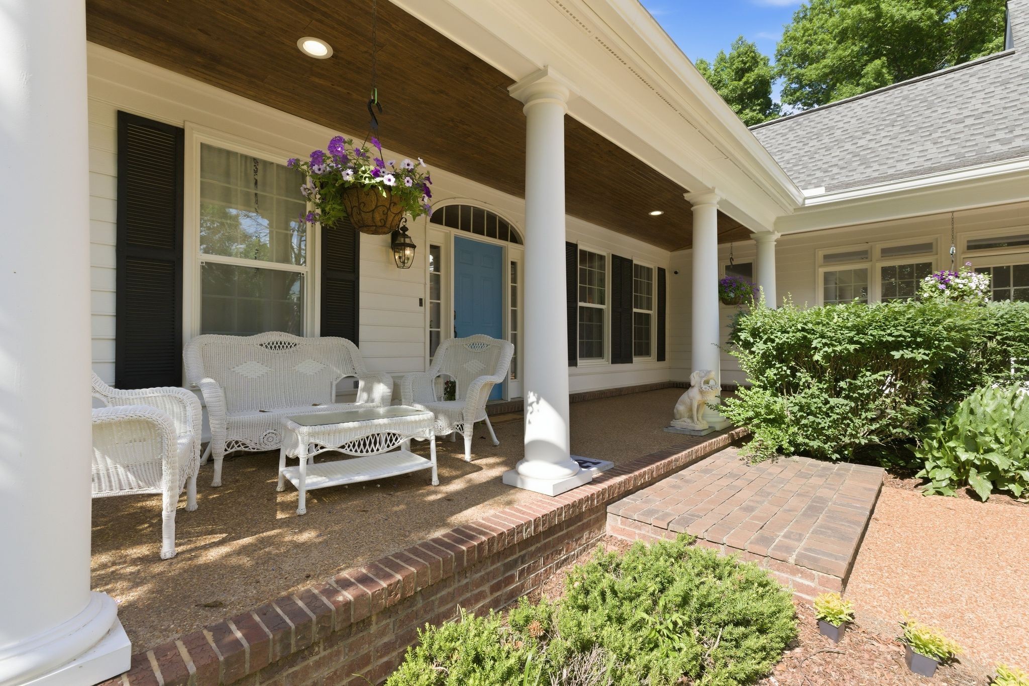 3016 Duplex Road Spring Hill, TN 37174 - Photo 2 of 61 a front view of a house with outdoor seating and flowers