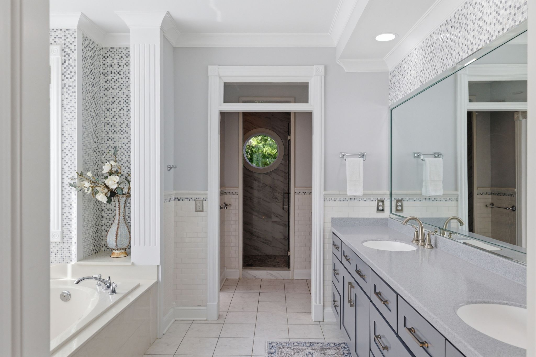 3016 Duplex Road Spring Hill, TN 37174 - Photo 28 of 61 a bathroom with a granite countertop tub a sink and a large mirror