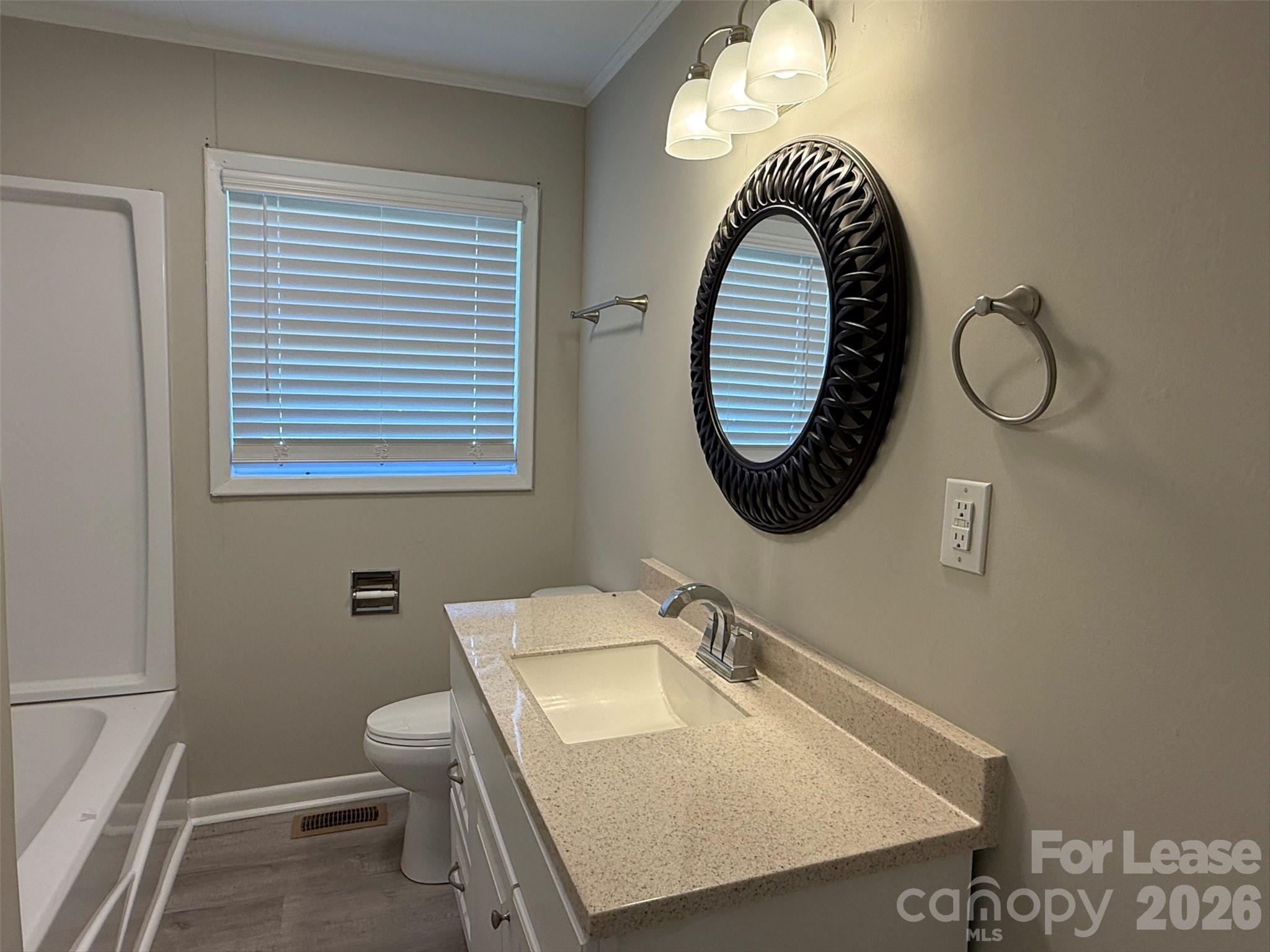 1771 River Road Lincolnton, NC 28092 - Photo 10 of 12 a bathroom with a sink and a mirror