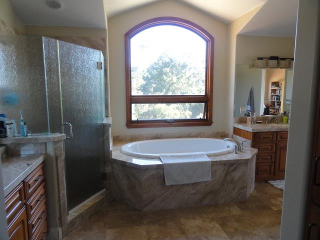 3165 Bird Rock Road Pebble Beach, CA 93953 - Photo 12 of 18 a spacious bathroom with a bathtub and a sink