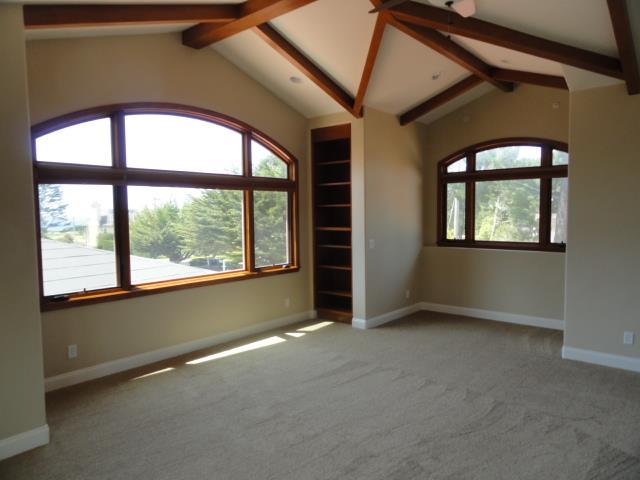 3165 Bird Rock Road Pebble Beach, CA 93953 - Photo 13 of 18 an empty room with windows and closet