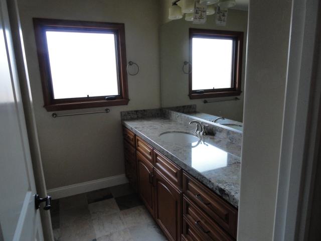 3165 Bird Rock Road Pebble Beach, CA 93953 - Photo 14 of 18 a bathroom with a granite countertop sink and a