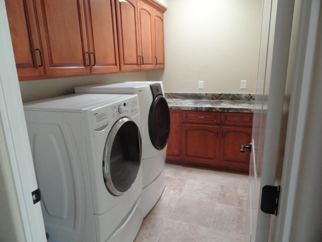 3165 Bird Rock Road Pebble Beach, CA 93953 - Photo 18 of 18 a utility room with dryer and washer