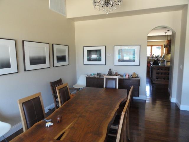 3165 Bird Rock Road Pebble Beach, CA 93953 - Photo 4 of 18 a view of a dining room with furniture and wooden floor