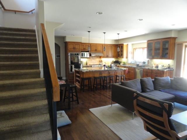 3165 Bird Rock Road Pebble Beach, CA 93953 - Photo 7 of 18 a living room with lots of furniture and a dining table with wooden floor