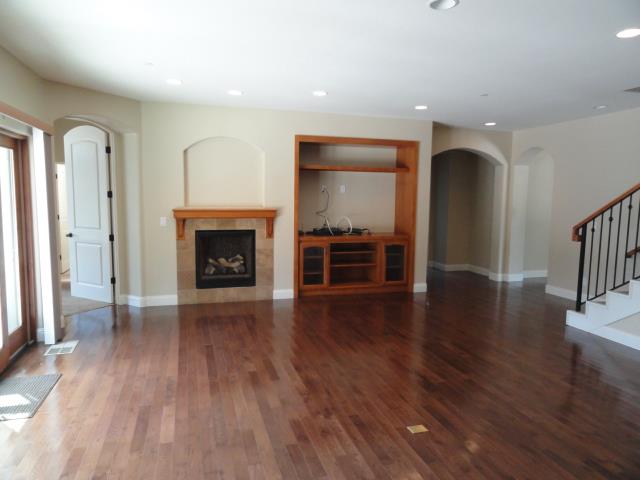 3165 Bird Rock Road Pebble Beach, CA 93953 - Photo 8 of 18 an entryway with fireplace and wooden floor