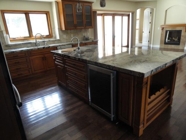 3165 Bird Rock Road Pebble Beach, CA 93953 - Photo 9 of 18 a kitchen with granite countertop a stove a sink and a window